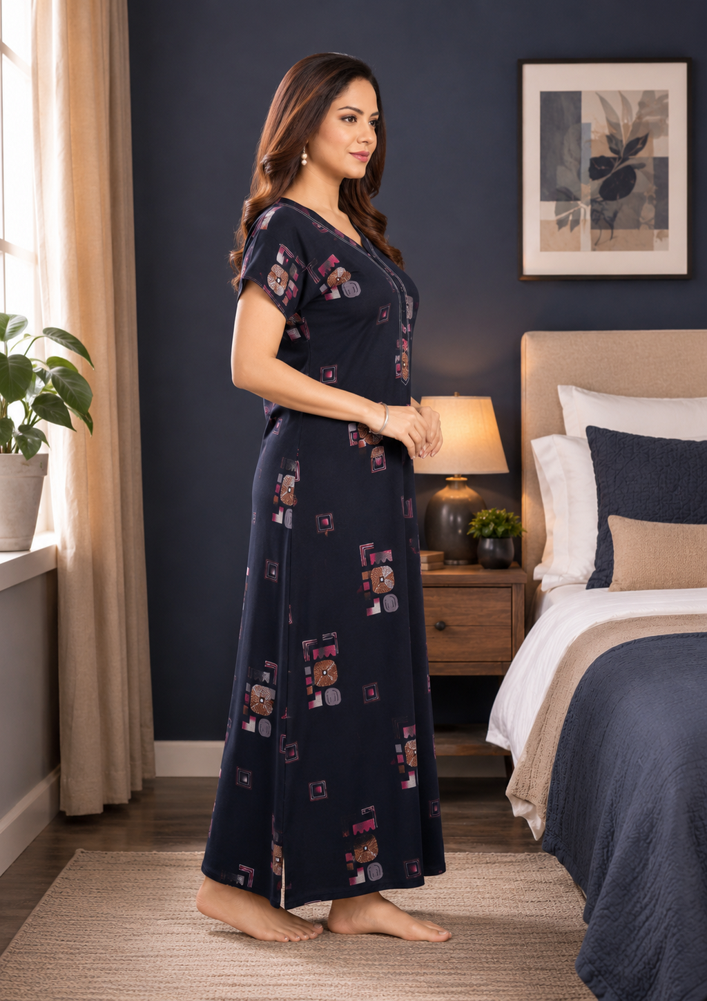 A woman modeling a navy blue nightgown with colorful cartoon character prints in a bedroom setting.