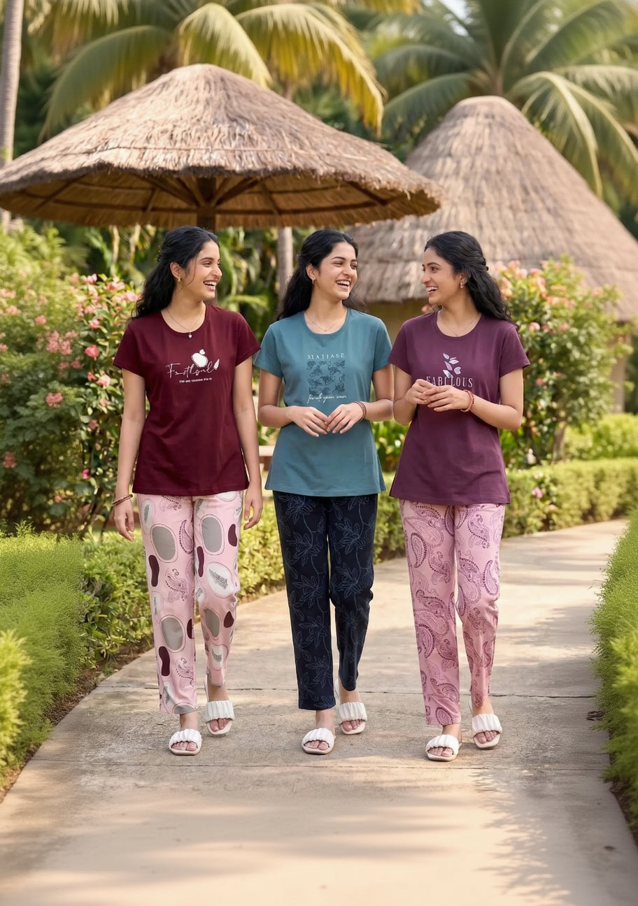 Three women walking together in a tropical setting with thatched umbrellas and huts.
